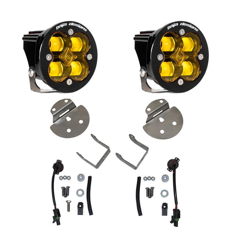 Baja Designs Squadron SAE Fog Pocket Light Kit, complete kit on a studio background: pair of round Squadron-R fog pods with amber lenses, round mounting plates, angled brackets, pigtail harnesses and hardware on white