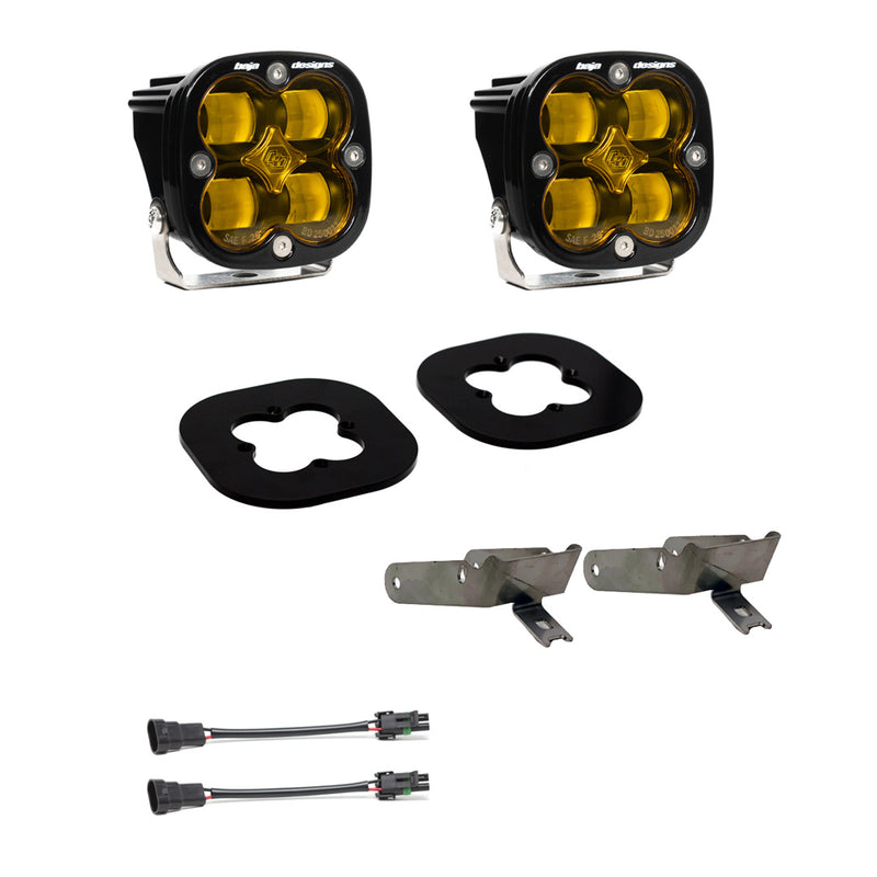 Baja Designs Squadron SAE Fog Pocket Light Kit, complete kit on a studio background: pair of square Squadron pods with black rubber gaskets, steel brackets and two pigtail harnesses, amber lenses laid out on a white background. Lens color differs