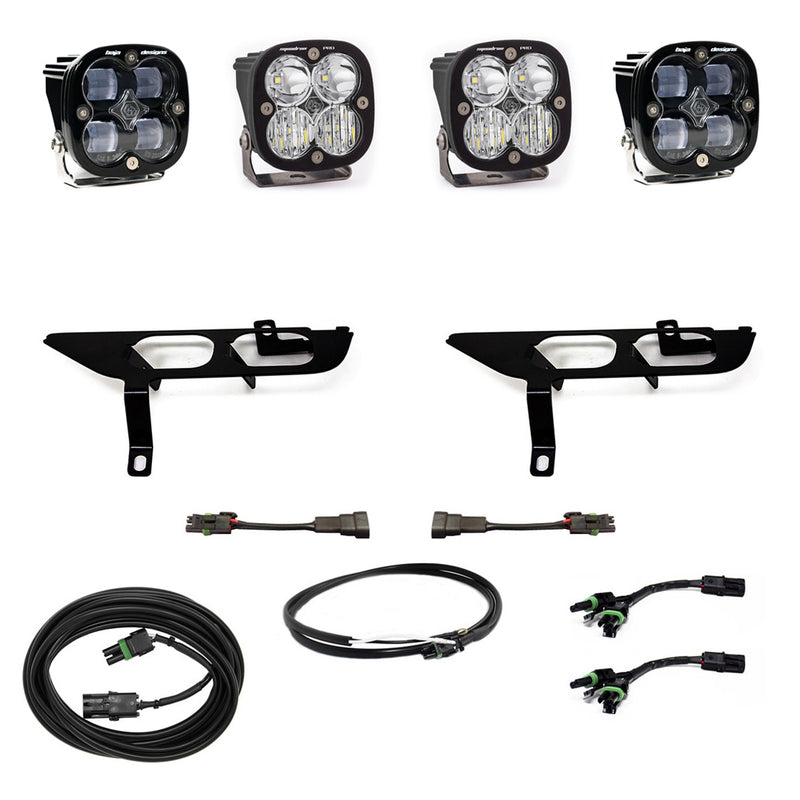 Baja Designs Squadron SAE/Pro Fog Pocket Light Kit, complete kit on a studio background: four black Squadron pods with clear lenses, two black fog pocket brackets, adapter harnesses and coiled cables on white