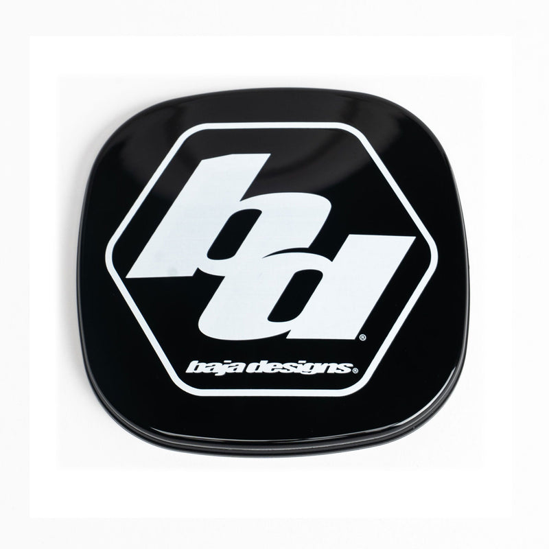 Baja Designs Squadron Single Rock Guard, whole product on a studio background: A black Squadron rock guard with the white Baja Designs logo on a light background with a faint gray edge