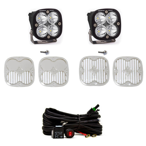 Baja Designs Squadron Sport A-Pillar Light Kit, complete kit on a studio background: two black Squadron Sport pods with clear lenses shown with mounting bolts, four clear lens covers and a switched relay harness on white