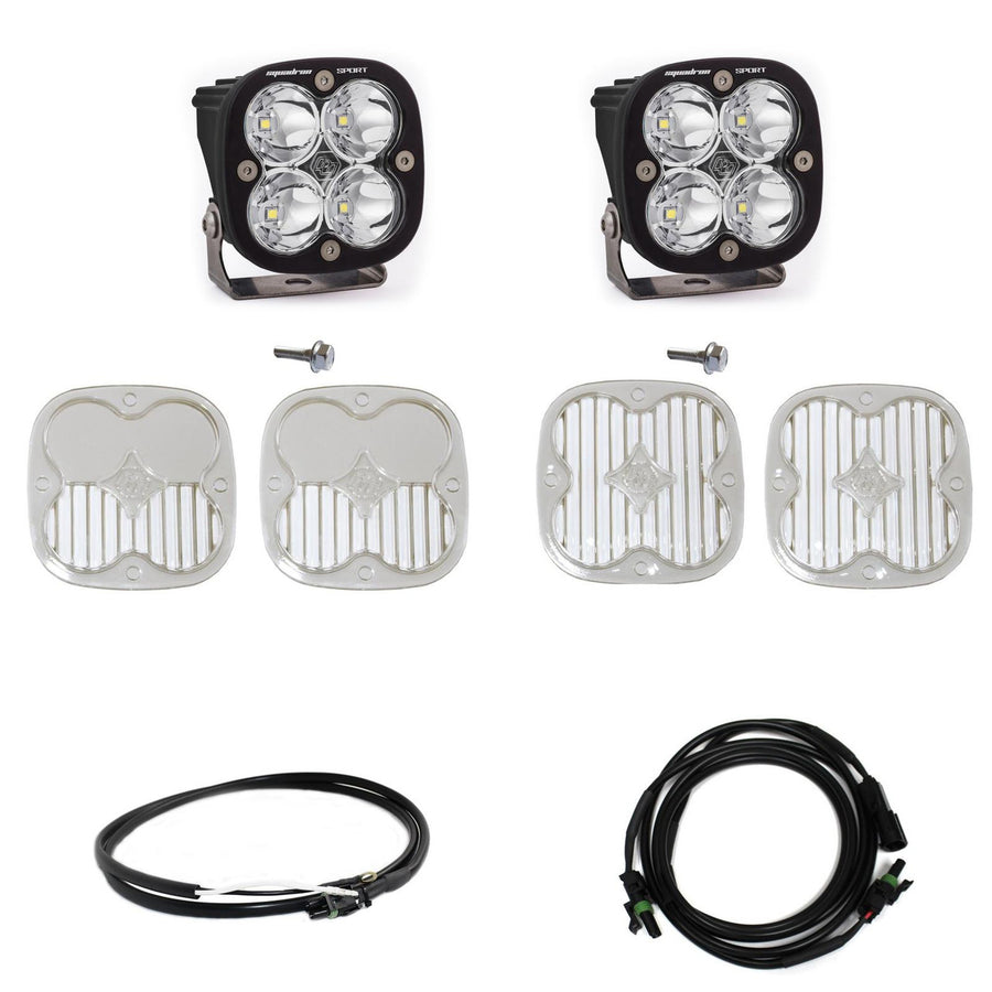 Baja Designs Squadron Sport A-Pillar Light Kit, complete kit on a studio background: two black Squadron Sport pods with clear lenses shown with mounting bolts, four clear lens covers and two wiring harnesses on white