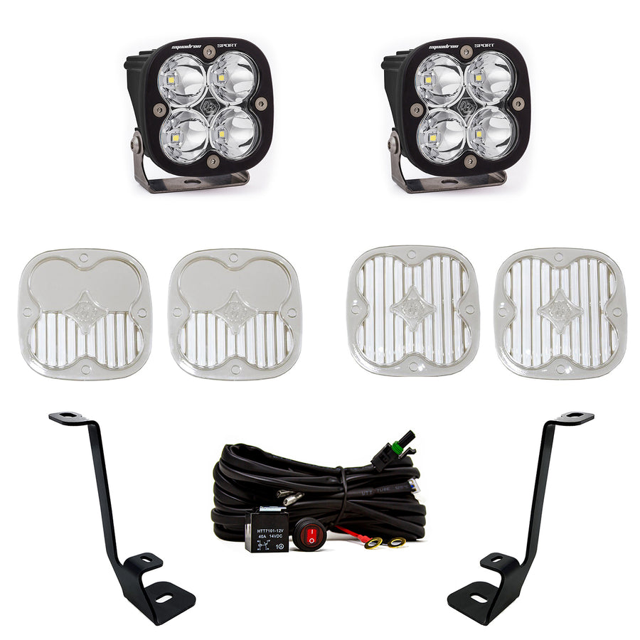 Baja Designs Squadron Sport A-Pillar Light Kit, complete kit on a studio background: two Squadron Sport LED pods with clear lenses, four lens covers, two A-pillar brackets and a wiring harness on white