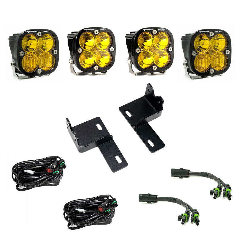 Baja Designs Squadron Sport Behind-the-Grille Kit, complete kit on a studio background: four amber-lens Squadron Sport LED pods with two grille brackets, two switched harnesses and two splitter harnesses on white