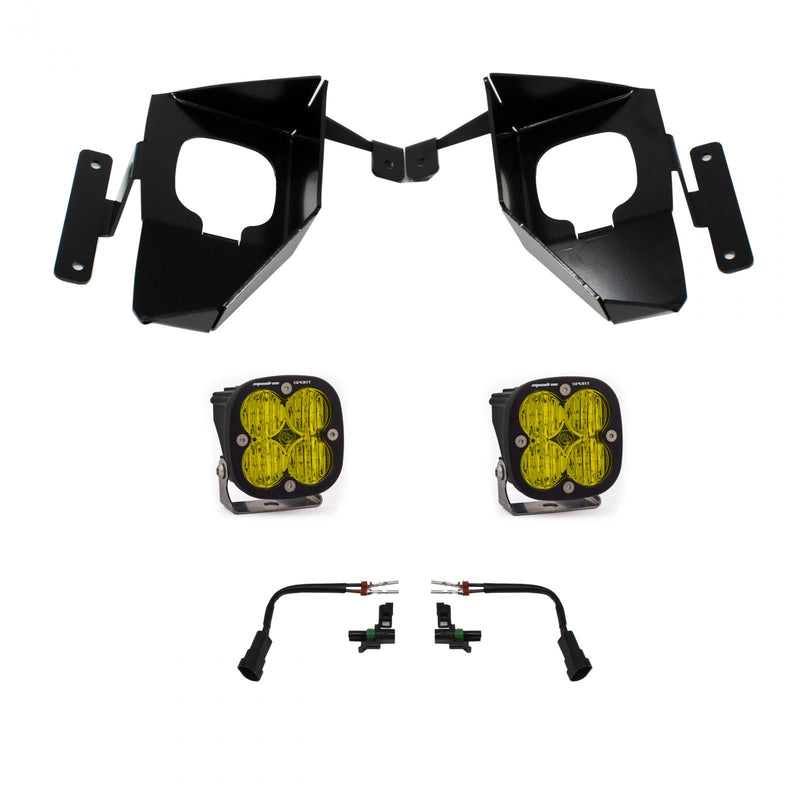 Baja Designs Squadron Sport Fog Pocket Light Kit, complete kit on a studio background: pair of black Squadron Sport fog pods with amber lenses, two black fog pocket brackets and two adapter harnesses on white; amber lens while sibling 447537 is the