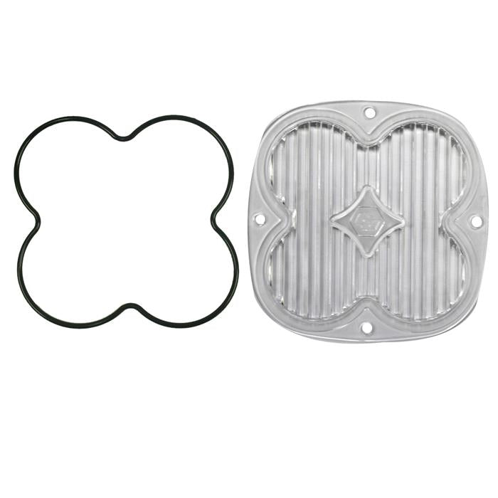 Baja Designs XL Light Pod Lens Kit, complete kit on a studio background: A clear XL pod lens with a fluted face beside a black clover shaped gasket on a white background. Title gives no lens color and this SKU shows several colors, so the color