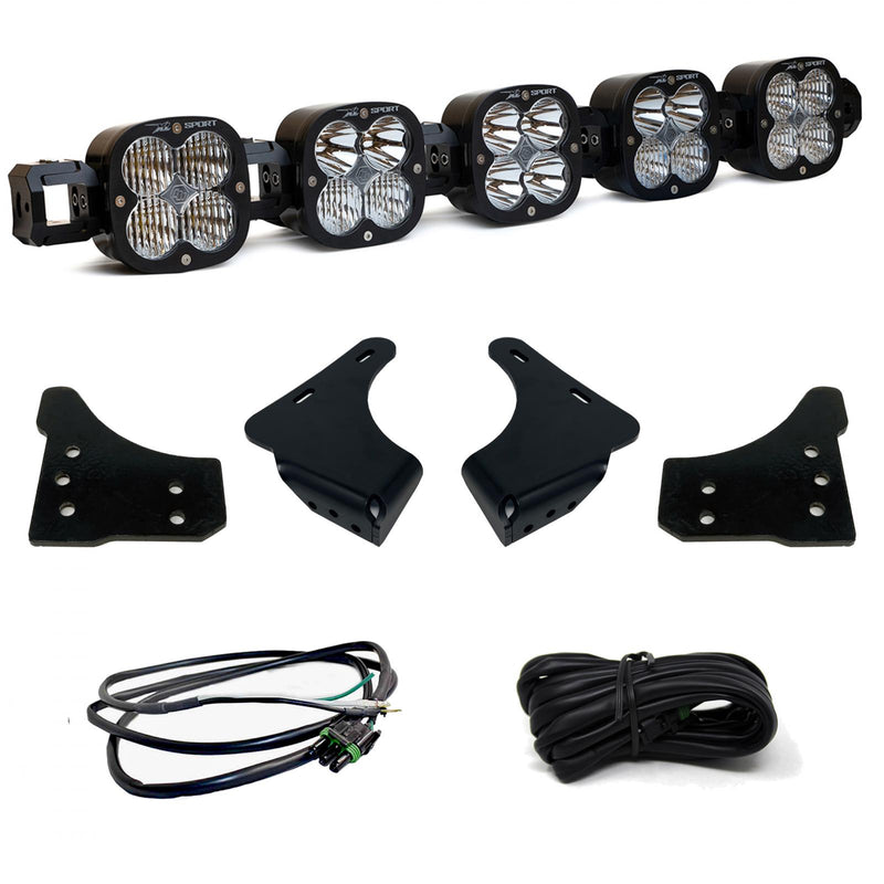 Baja Designs XL Linkable Bumper Light Kit, complete kit on a studio background: A five-pod XL Linkable light bar kit on white with four bumper brackets, a pigtail harness and a coiled extension harness
