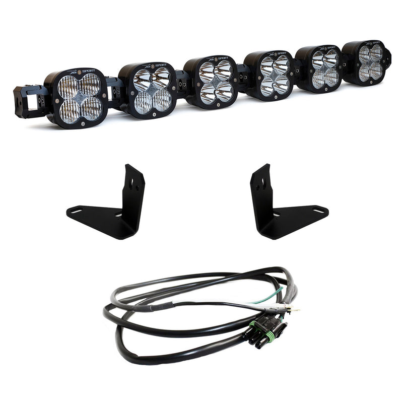 Baja Designs XL Linkable Bumper Light Kit, complete kit on a studio background: six linked Baja Designs XL pods with clear lenses shown with two black mounting brackets and a wiring harness on white