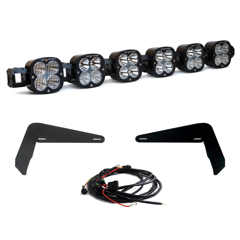 Baja Designs XL Linkable Bumper Light Kit, complete kit on a studio background: six XL pods joined as one linkable bar with two flat black bumper brackets and a wiring harness on white