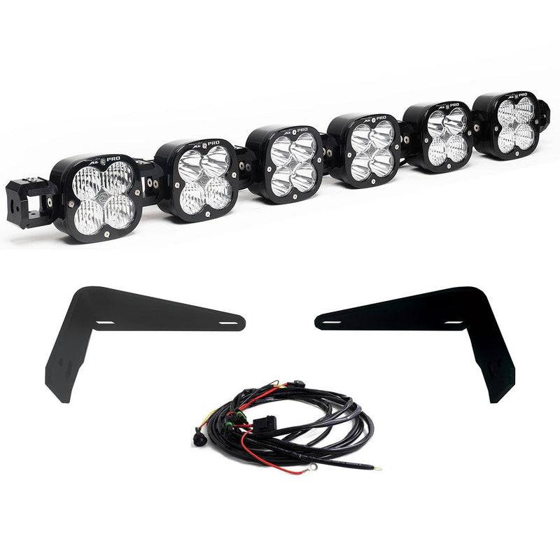 Baja Designs XL Linkable Bumper Light Kit, complete kit on a studio background: six XL Pro pods joined as one linkable bar with two flat black bumper brackets and a wiring harness on white