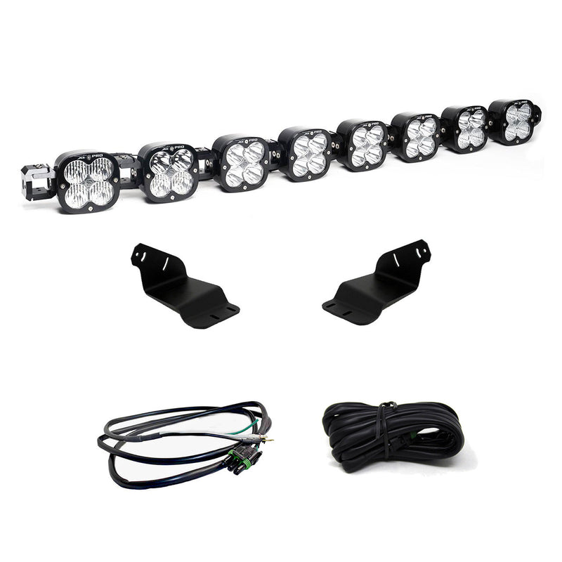 Baja Designs XL Linkable Roof Mount Light Kit, complete kit on a studio background: an eight-pod linkable LED roof bar with two black brackets and two coiled harnesses on a white background