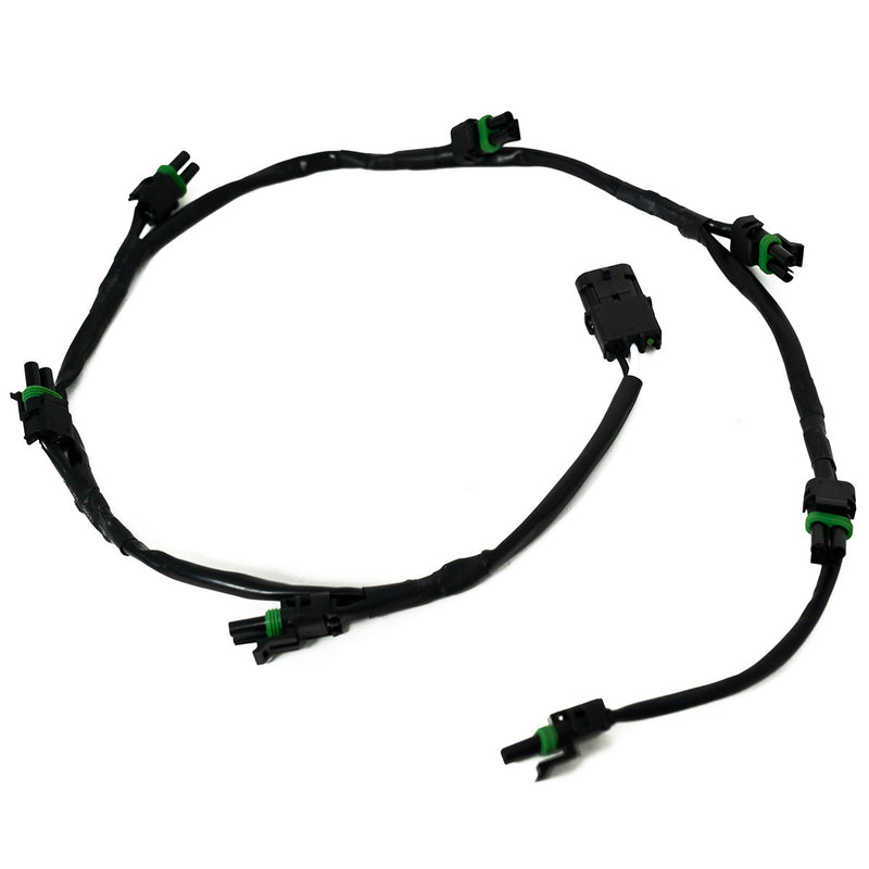 Baja Designs XL Linkable Wiring Harness, whole product on a studio background: A black linkable wiring harness with a main connector and several weatherproof light pigtails on a white background