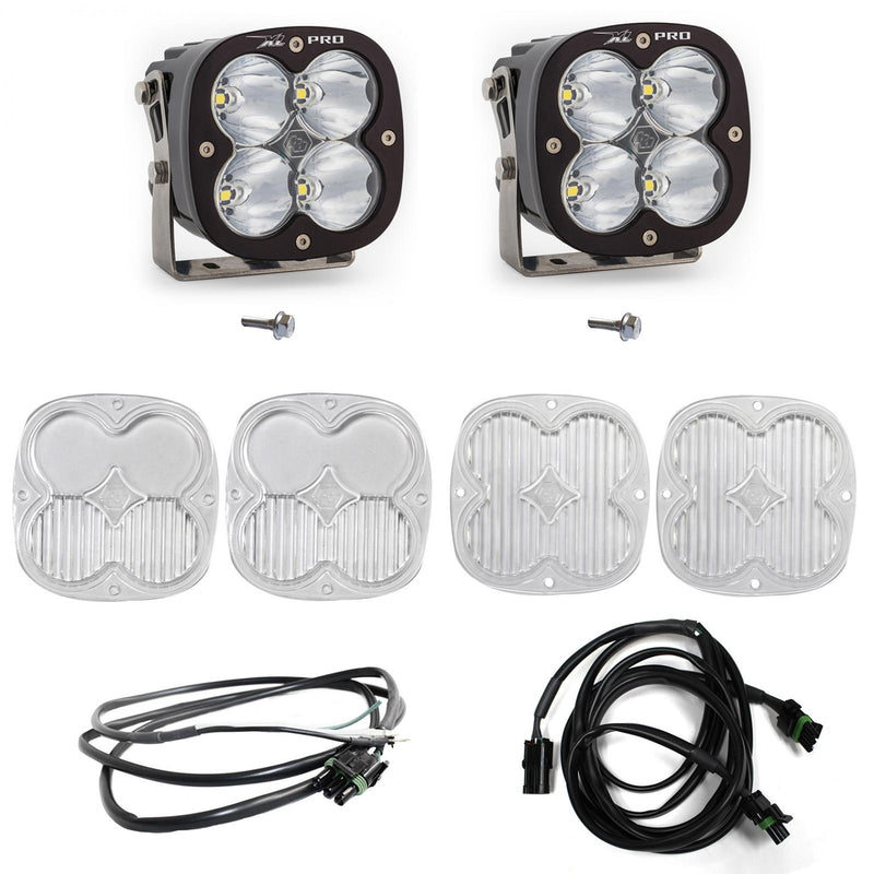Baja Designs XL Pro A-Pillar Light Kit, complete kit on a studio background: two black XL Pro pods with clear lenses shown with mounting bolts, four clear lens covers and two wiring harnesses on white