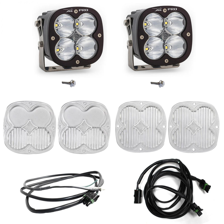 Baja Designs XL Pro A-Pillar Light Kit, complete kit on a studio background: two black XL Pro pods with clear lenses shown with mounting bolts, four clear lens covers and two wiring harnesses on white