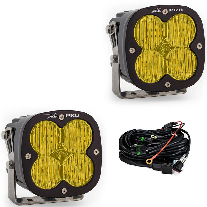 Baja Designs XL Pro LED Auxiliary Light Pod Pair, whole product on a studio background: A pair of black XL Pro LED light pods with amber wide cornering lenses on stainless brackets, shown with the wiring harness on a white background