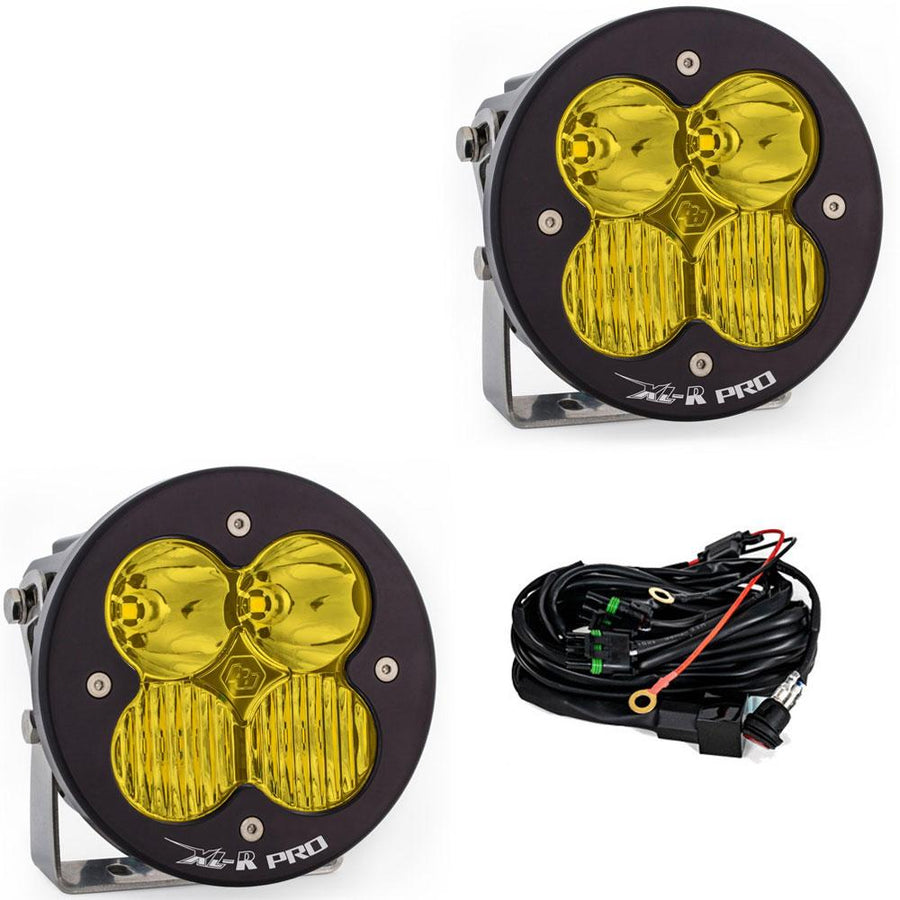 Baja Designs XL-R Pro LED Auxiliary Light Pod Pair, whole product on a studio background: A pair of black XL-R Pro LED light pods with amber driving/combo lenses on stainless brackets, shown with the wiring harness on a white background