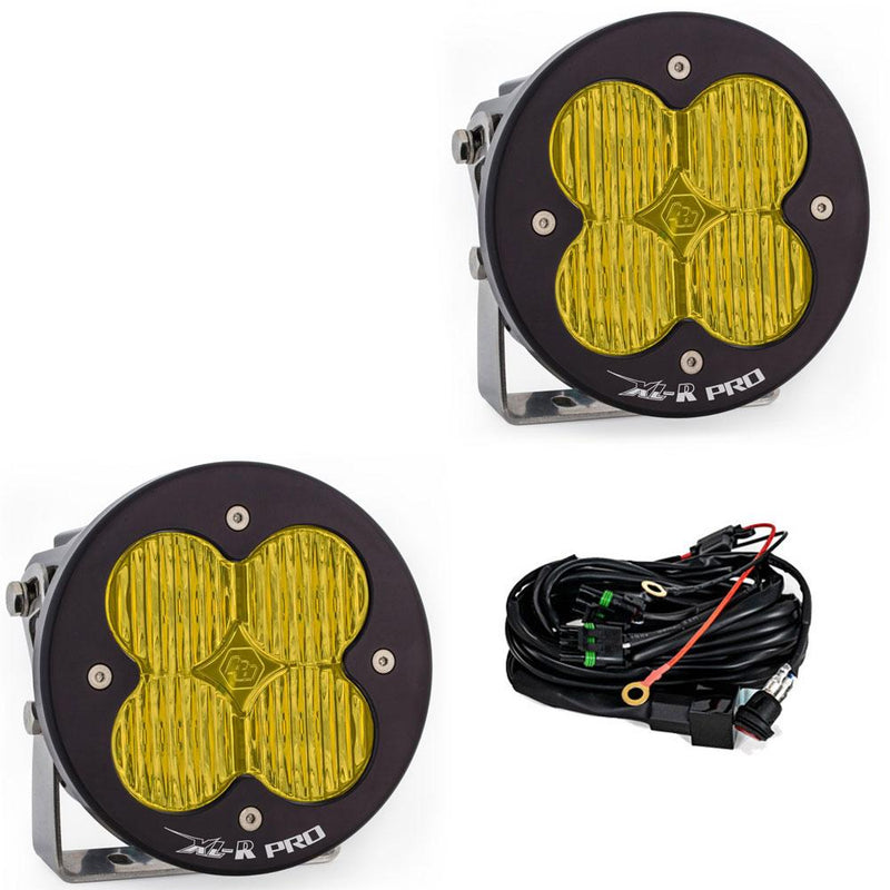 Baja Designs XL-R Pro LED Auxiliary Light Pod Pair, whole product on a studio background: A pair of black XL-R Pro LED light pods with amber wide cornering lenses on stainless brackets, shown with the wiring harness on a white background