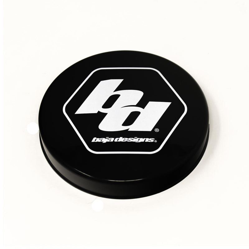Baja Designs XL-R Single Rock Guard, whole product on a studio background: A black round rock guard cover with a white Baja Designs hex logo on a white background. Title gives no lens color and this SKU shows several colors, so the color for this SKU