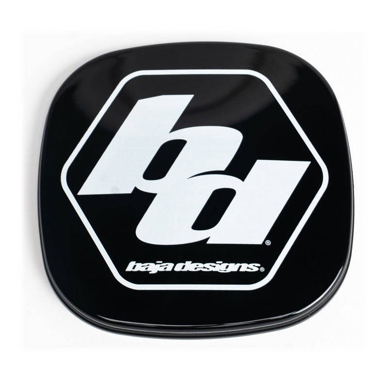 Baja Designs XL Single Rock Guard, whole product on a studio background: A black square rock guard cover with a white Baja Designs hex logo, shown on a white background. Title gives no lens color and this SKU shows several colors, so the color