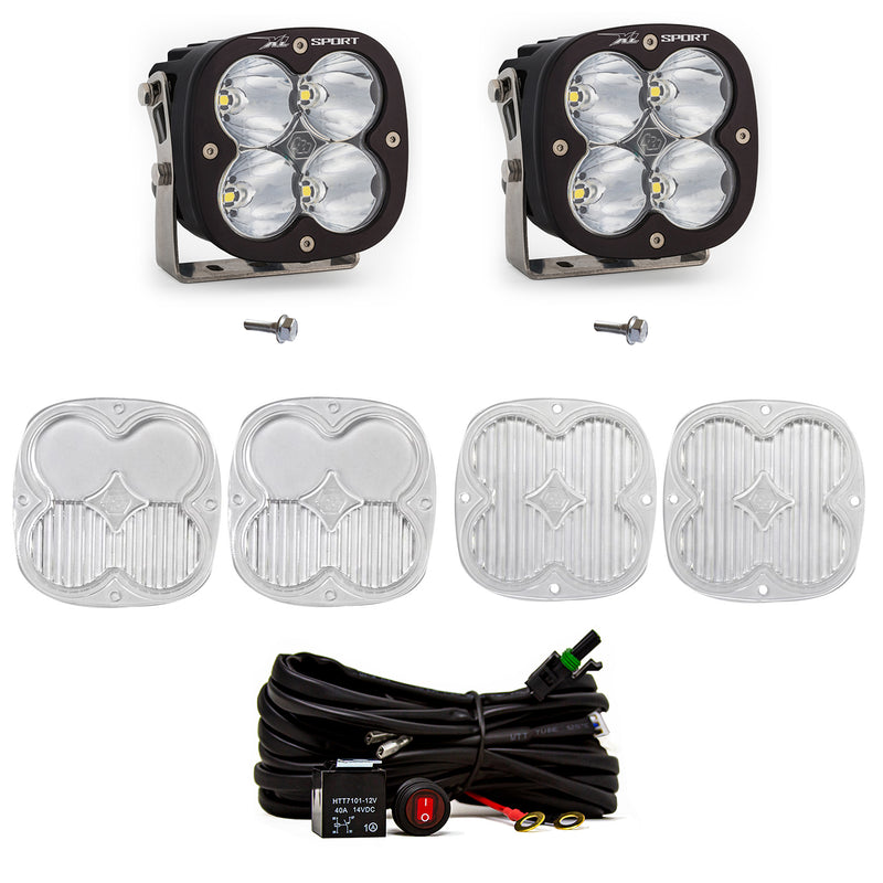 Baja Designs XL Sport A-Pillar Light Kit, complete kit on a studio background: two black XL Pro pods with clear lenses shown with mounting bolts, four clear lens covers and a switched relay harness on white