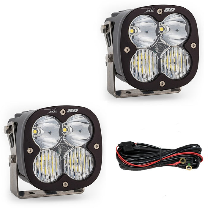 Baja Designs XL80 Bumper Light Kit, complete kit on a studio background: two black XL80 pods with clear lenses and wiring on white