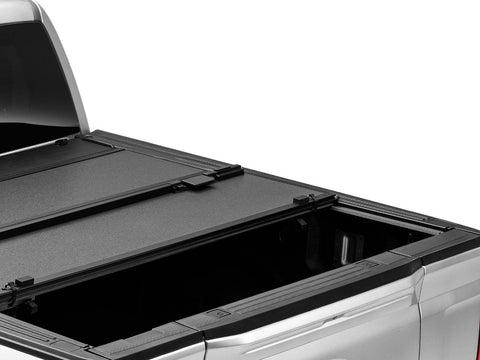 BAKFlip MX4 EZ-Lift hard folding tonneau cover seen from above the bed rails, rear panel folded forward