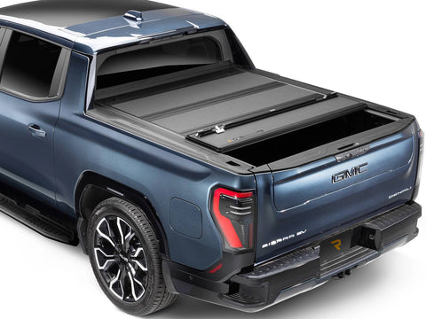 BAKFlip MX4 hard folding tonneau cover on a GMC Sierra EV, rear panel folded forward