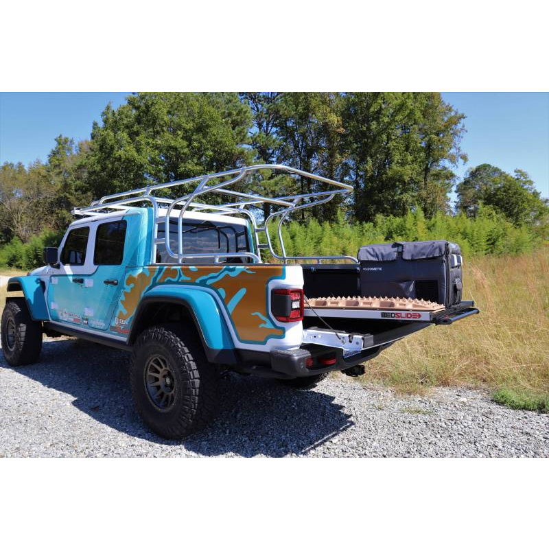 Jeep Gladiator with a BEDSLIDE cargo slide in Silver finish extended out carrying recovery boards and a fridge