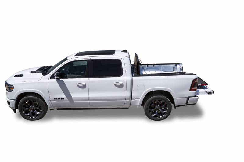 Side profile of a white Ram 1500 with a BEDSLIDE MAX Extension cargo slide in Black Edition finish nearly retracted