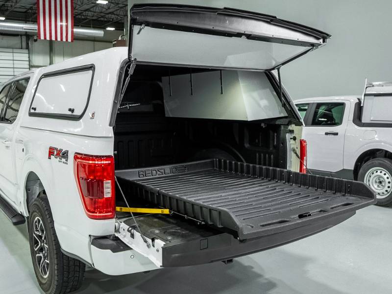 BEDSLIDE 500Go tray rolled out of a capped Ford F-150 bed
