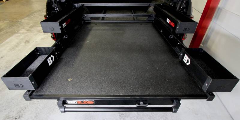 Full view of a Black Edition BEDSLIDE deck with the complete black BEDBIN kit mounted around it