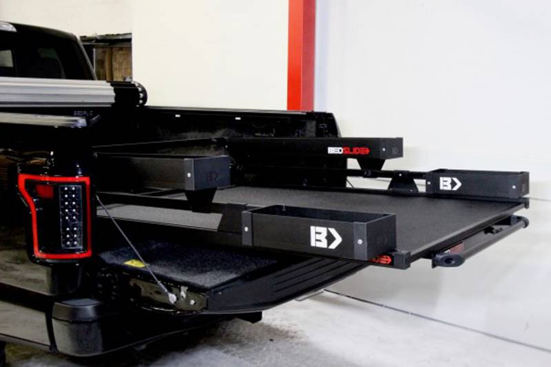 Black Edition BEDSLIDE with the BEDBIN kit fitted, deck rolled out over the open tailgate