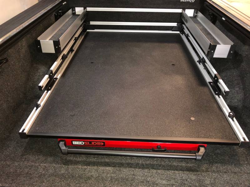Looking along a BEDSLIDE deck from the tailgate with the silver Side Kix bins fitted down both sides
