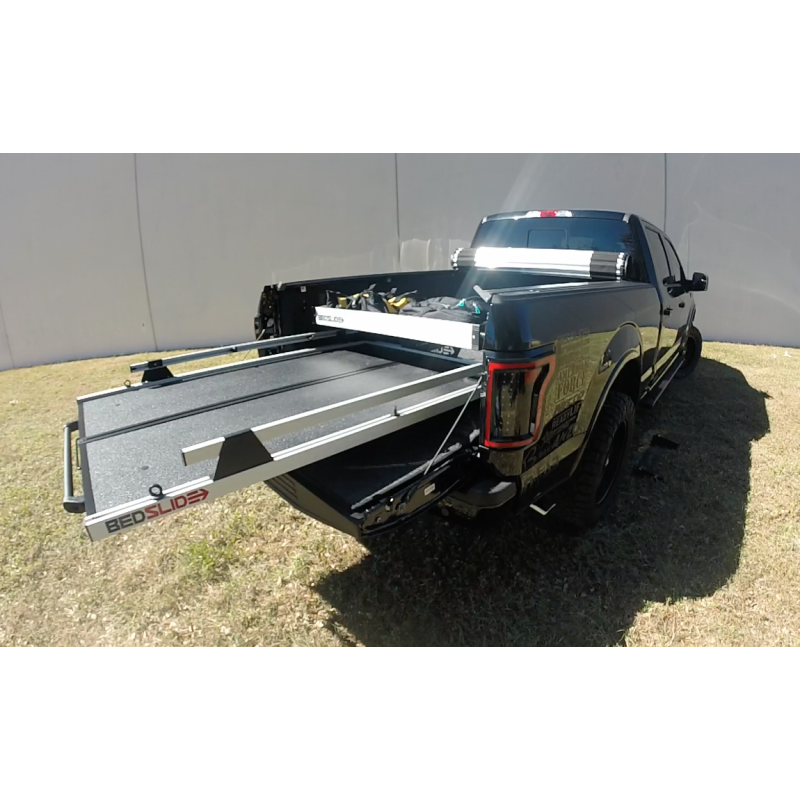 Truck with the BEDSLIDE deck rolled out and the silver upper tray mounted above it
