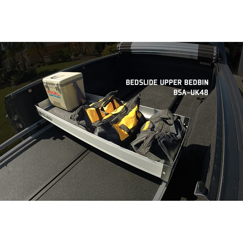 Silver upper BEDBIN tray mounted in a truck bed, captioned with the product name and part number