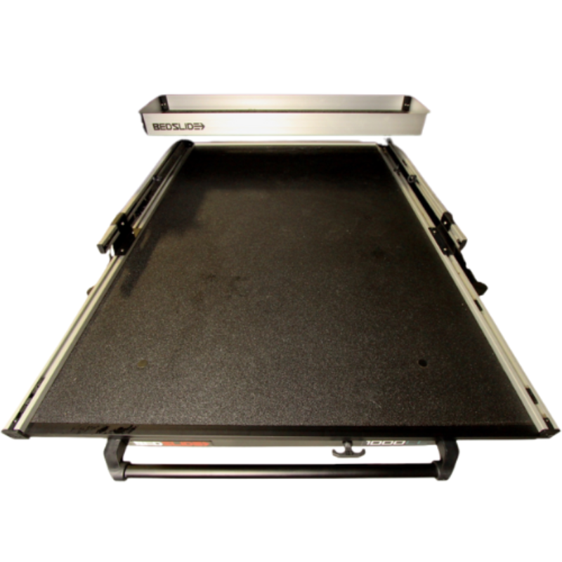Silver upper tray mounted across the front of an extended BEDSLIDE deck, viewed from above