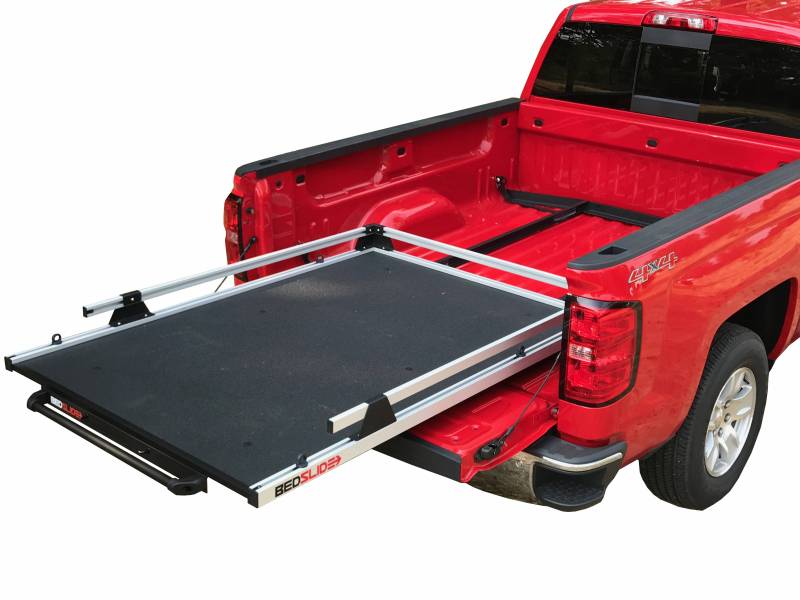 A BEDSLIDE cargo slide shown extended from the bed of a full-size pickup, illustrating what these brackets hold. The BEDSLIDE is not included with this kit