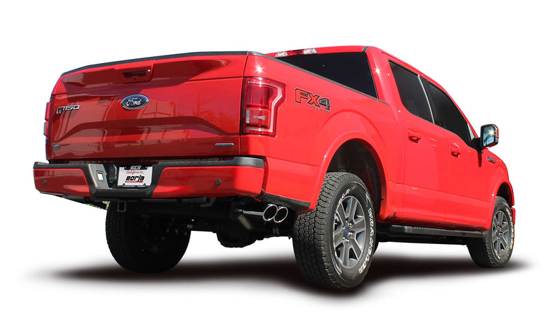 Borla ATAK Cat-Back Exhaust System installed on a Ford F-150: A red Ford F-150 FX4 SuperCrew seen from the rear quarter with polished exhaust tips and a Borla plate on the bumper