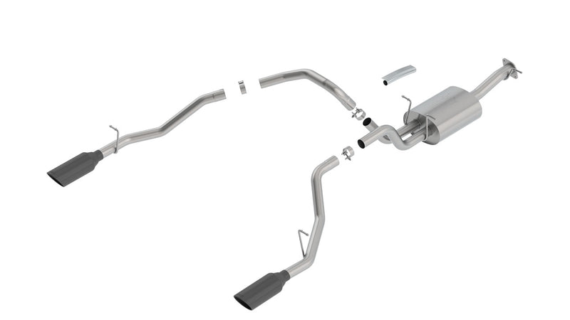 Borla ATAK Cat-Back Exhaust System, full system on a studio background: A stainless dual split rear exit cat-back exhaust with one muffler and two black chrome tips laid out on a white background