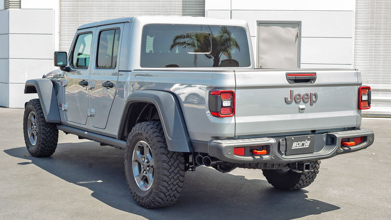 Borla ATAK Cat-Back Exhaust System installed on a Jeep Gladiator: rear three-quarter view of a silver Jeep Gladiator fitted with a Borla dual-tip exhaust