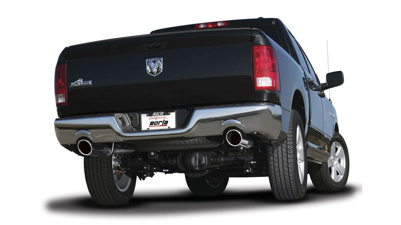 Borla S-Type Cat-Back Exhaust System installed on a Ram 1500: black Ram 1500 pickup from the rear showing polished Borla tips exiting at both corners of the rear bumper