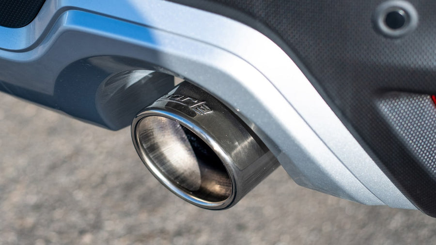 Axle-Back Exhaust Systems by Borla: A polished exhaust tip with a Borla logo exits below a blue rear bumper.