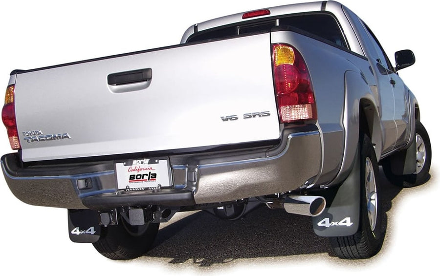 Cat-Back Exhaust Systems by Borla: Silver Toyota Tacoma 4x4 from the rear with a polished Borla tip exiting on the passenger side and a Borla plate.