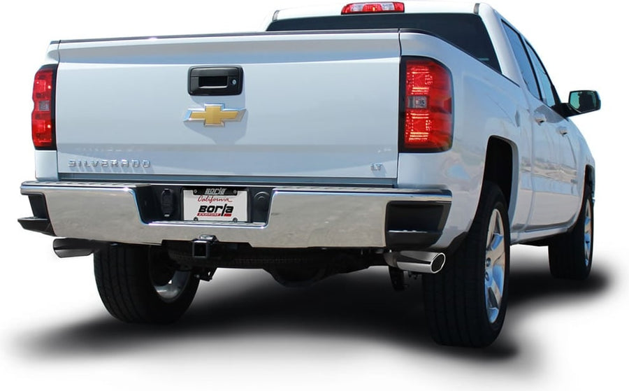 Cat-Back Exhaust Systems by Borla: Rear three-quarter view of a silver Chevrolet Silverado crew cab on white with an exhaust tip visible under the passenger side of the bumper.