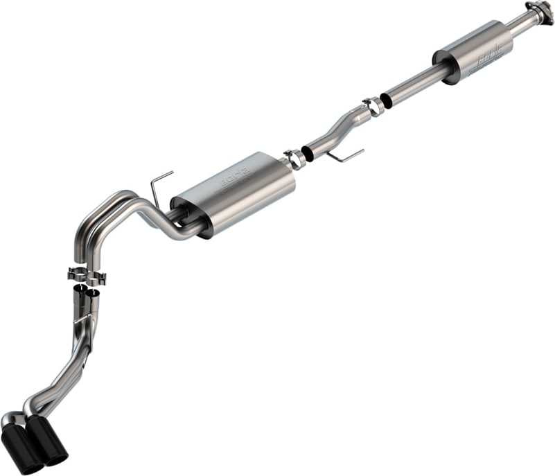 Cat-Back Exhaust Systems by Borla: Stainless side-exit cat-back exhaust on white with two mufflers and a tailpipe ending in paired black chrome tips.