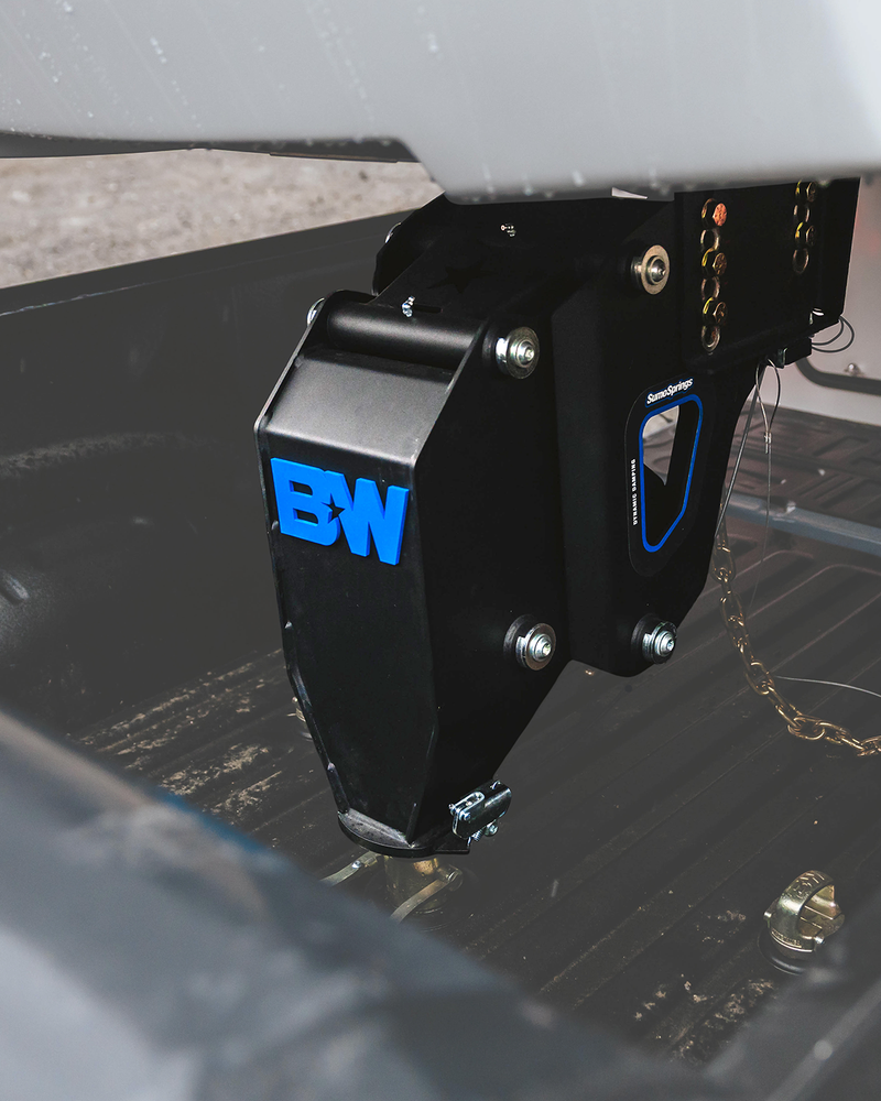 B&W fifth wheel to gooseneck adapter installed on a trailer pin box above a pickup bed