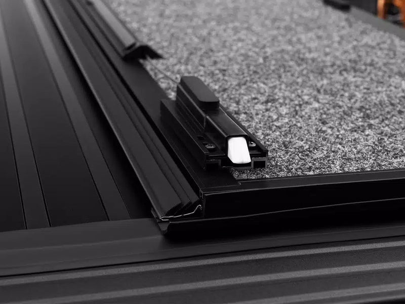 Close-up of the Ultra Flex panel edge extrusion and latch catch seated on the side rail.