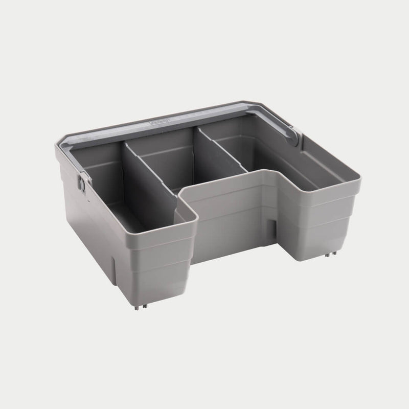 Gray DECKED Double Drawerganizer shown in studio with the carry handle folded flat across the top and the stepped compartments visible
