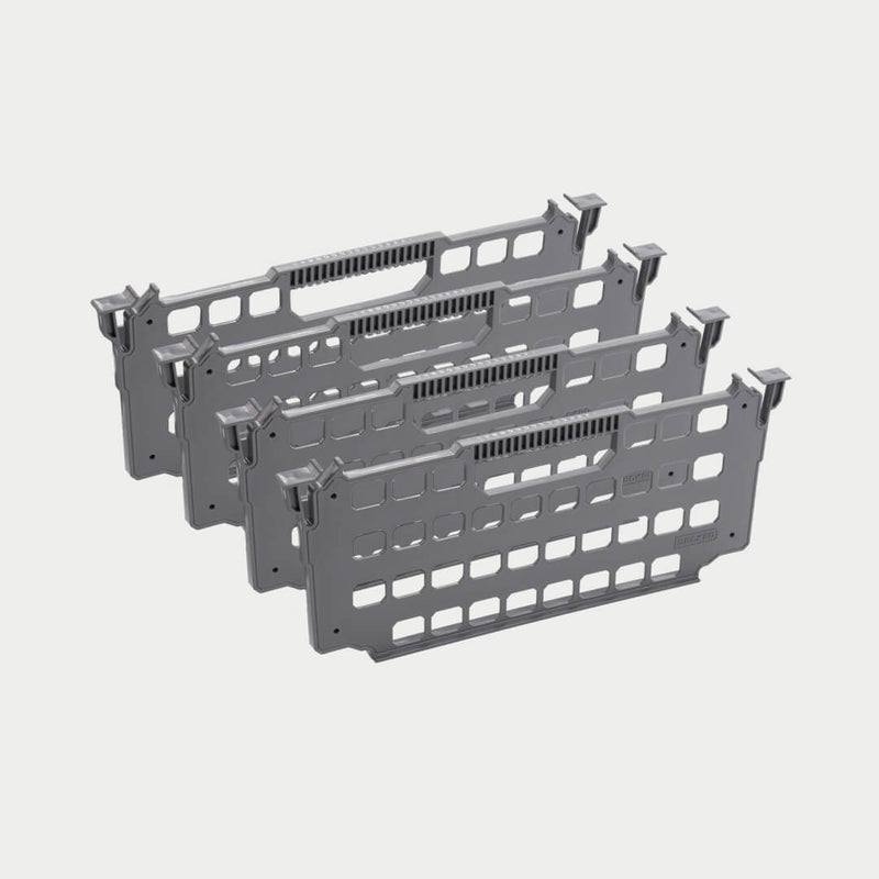 Four gray DECKED drawer dividers shown in studio stacked in a row, perforated panels with hook tabs on each end