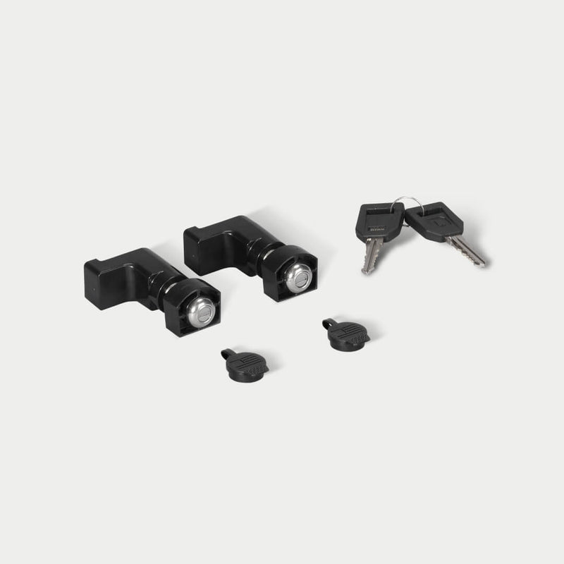 DECKED drawer lock 2-pack shown in studio: two black drawer locks, two black caps and two matching keys